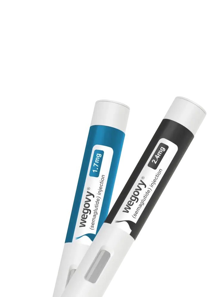 Two Wegovy pens, one blue labeled "1.7 mg" and one black labeled "2.4 mg," used for semaglutide injections. They are positioned diagonally against a white background.